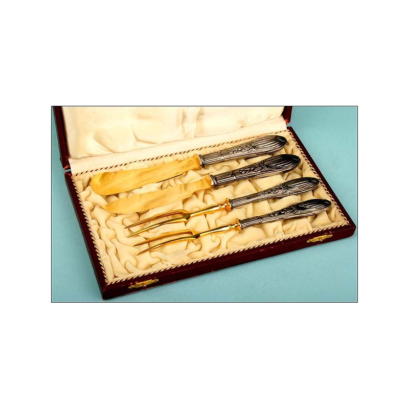 Case with four silver and gold flatware