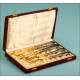 Case with four silver and gold flatware