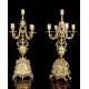 Antique set of mantel clock and pair of candlesticks. France, 19th Century