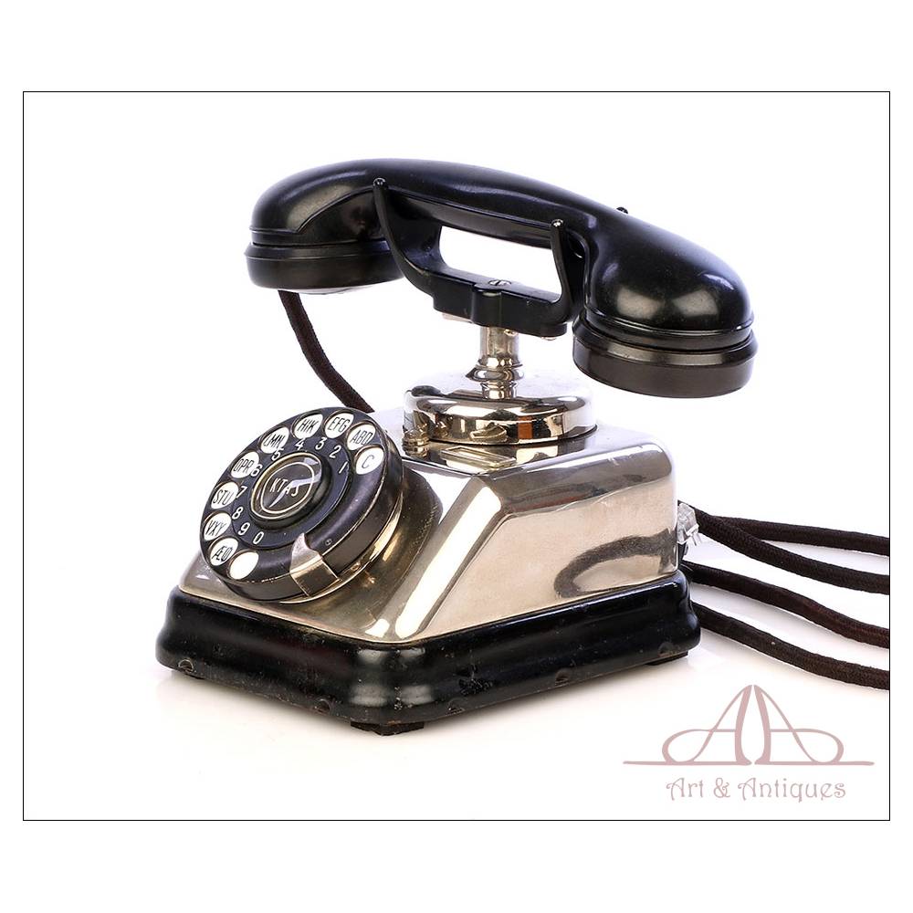 Vintage antiguo teléfono fijo de plástico negro brillante con dial
