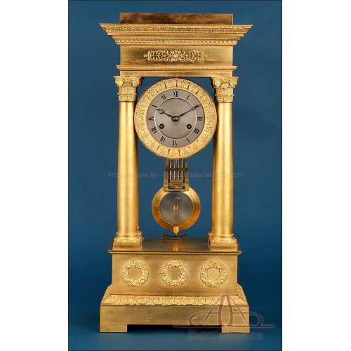 Antique Gilt Bronze Portico Clock with Four Columns. France, 19th Century