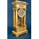 Antique Gilt Bronze Portico Clock with Four Columns. France, 19th Century