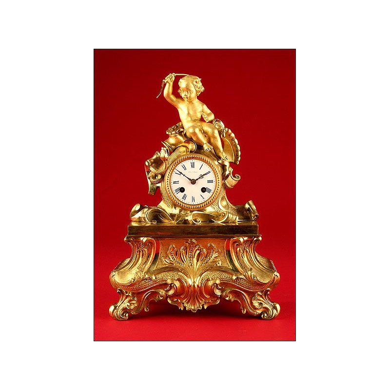 Decorative Mantel Clock in Gilded Bronze. Second half s. XIX.