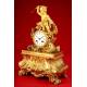 Decorative Mantel Clock in Gilded Bronze. Second half s. XIX.