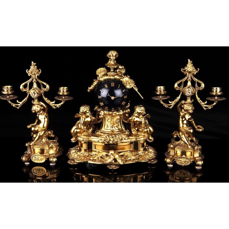 Gilded Bronze Clock and Candelabra Set. France, XIX Century