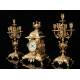 Spectacular Clock and Candelabra Set in gilded bronze. France, XIX Century