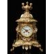 Spectacular Clock and Candelabra Set in gilded bronze. France, XIX Century