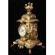 Spectacular Clock and Candelabra Set in gilded bronze. France, XIX Century