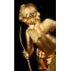 Delicate Mantel Clock in Gilded Bronze with Cupid. France, XIX Century