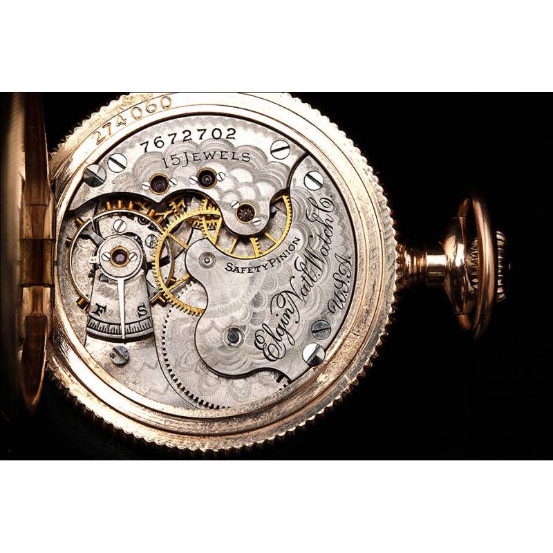 Bello reloj de bolsillo chapado en oro marca Elgin. Fabricado en EEUU circa  1900. Grabado a mano.