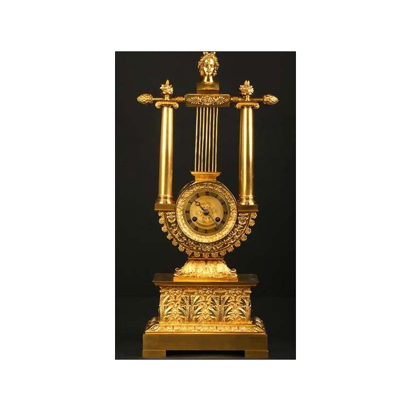 Antique gilt bronze and Lyre shape clock. S. XIX