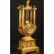 Antique gilt bronze and Lyre shape clock. S. XIX