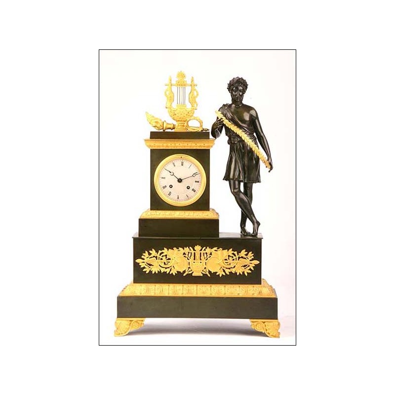 Empire type clock in gilt and blued bronze. 1820